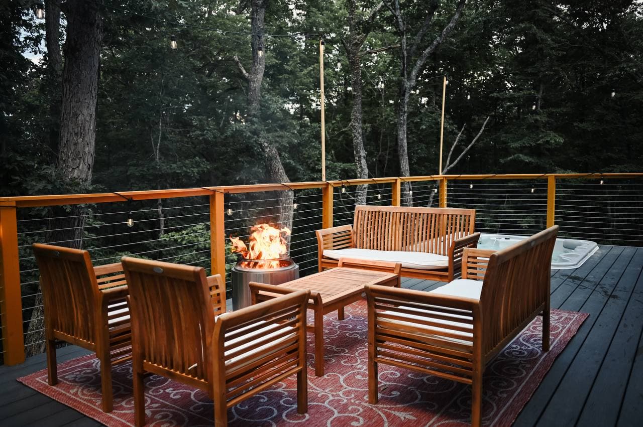 Fire and string lights on The Sparrow's deck at night