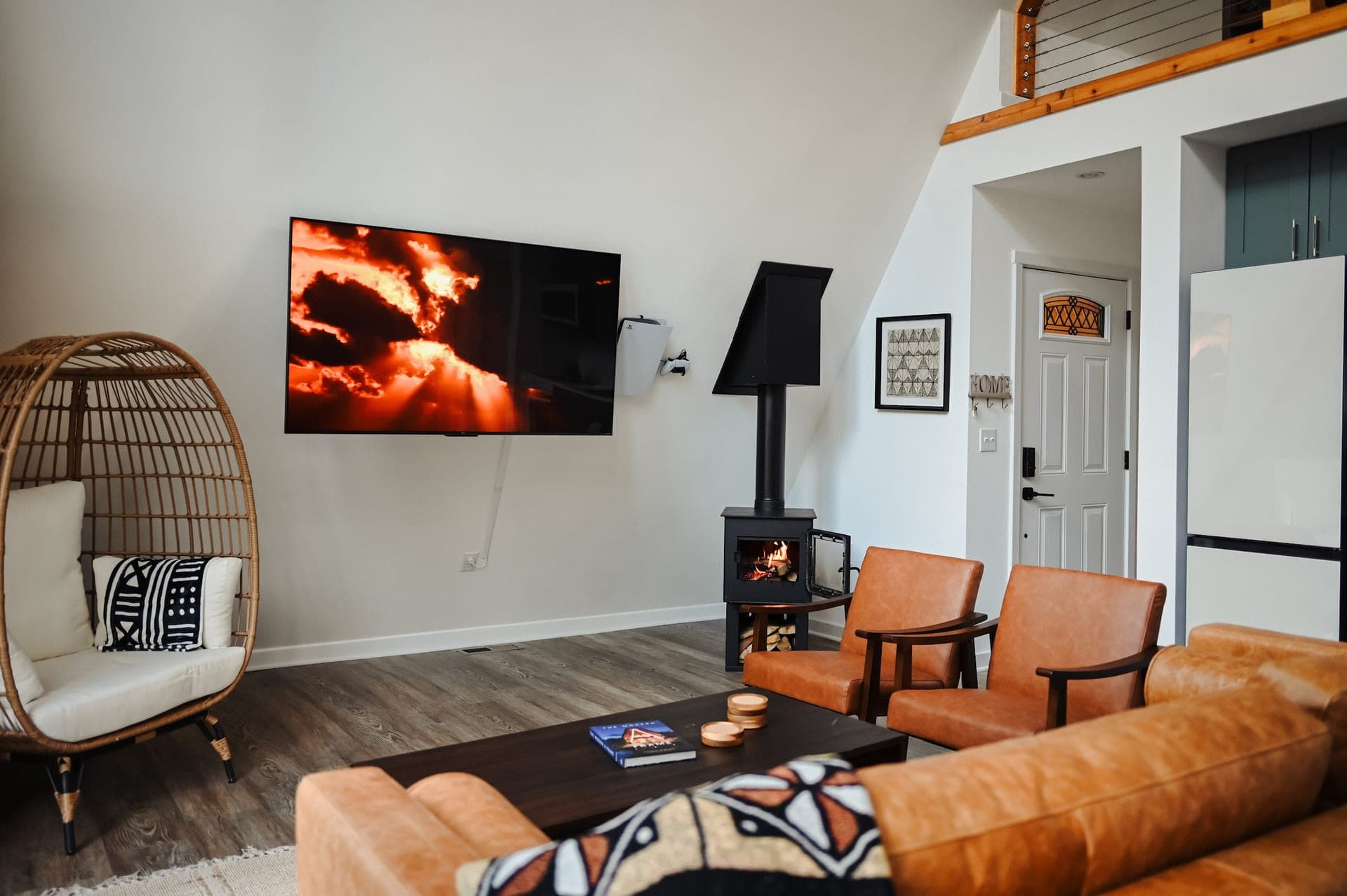 The Sparrow's living room looking toward the wood stove and a hanging egg chair