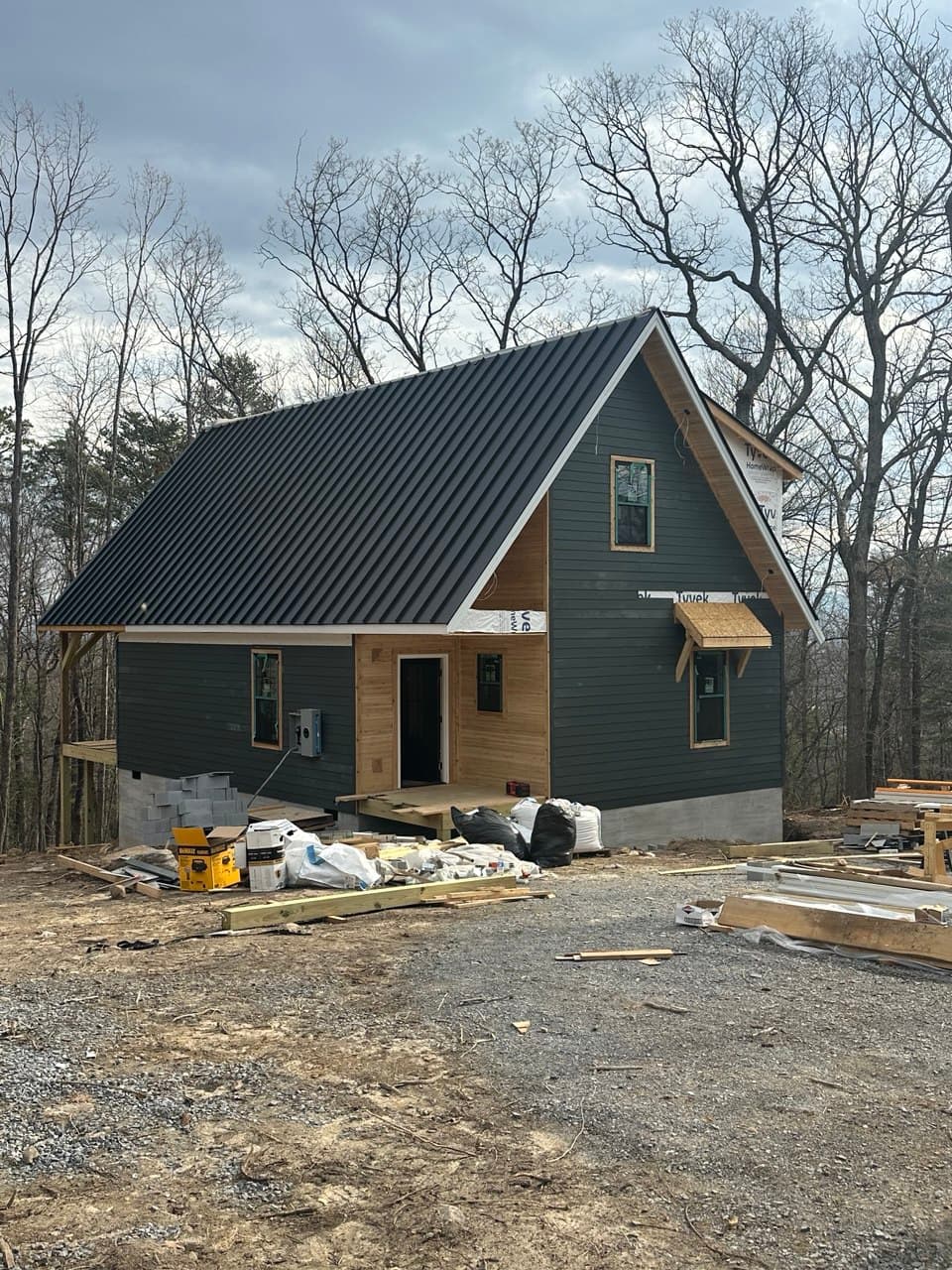 The Stag's dark green siding and cedar trim