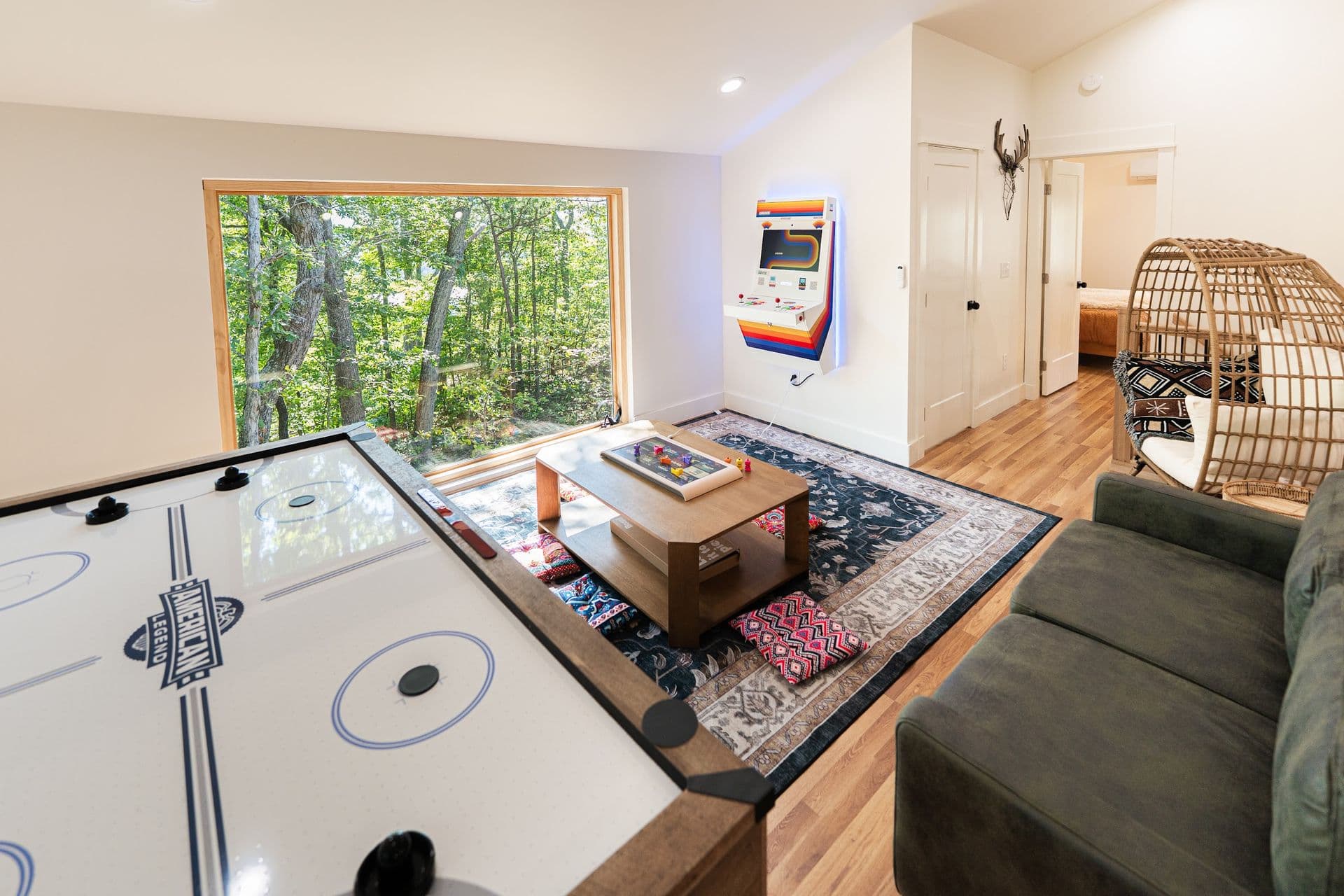 The Stag's game loft: air hockey, the Board game table, a leather sofa and an egg chair by the picture window