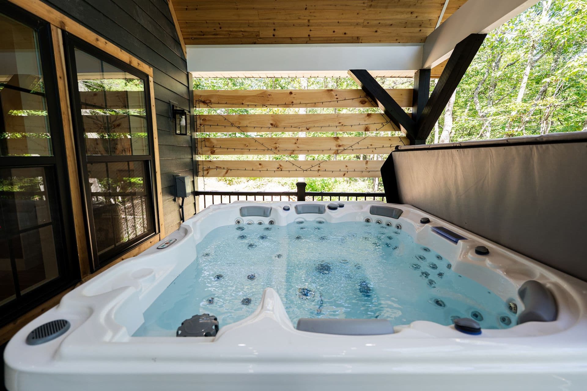 The private six-person hot tub on The Stag's covered deck