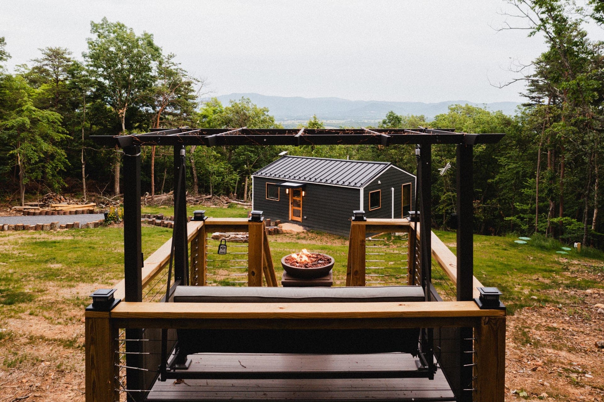 The Turtle framed by its pergola and fire pit, with the Shenandoah Valley behind