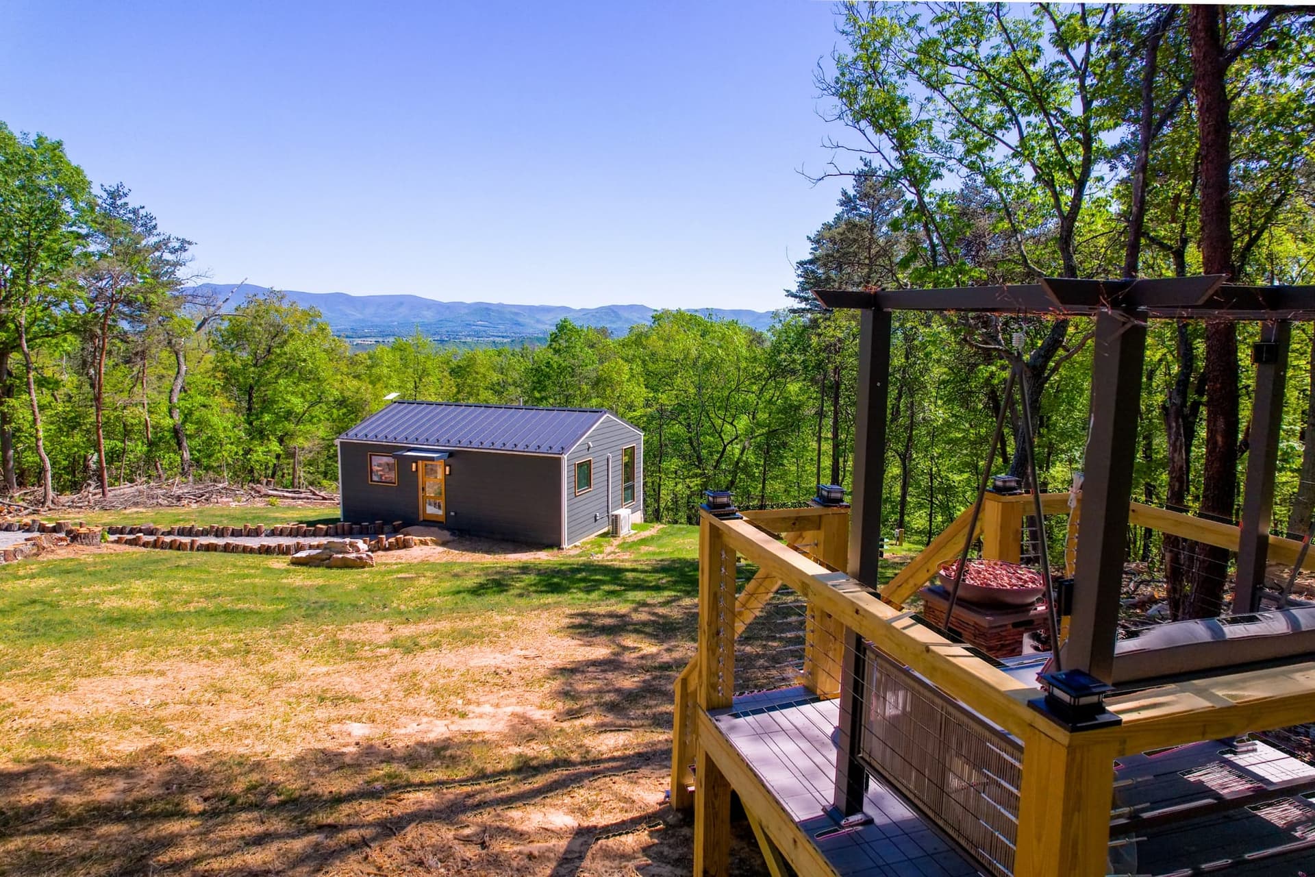 The Turtle, a small cabin on a wooded hillside outside Luray, with the Shenandoah Valley and the Blue Ridge beyond
