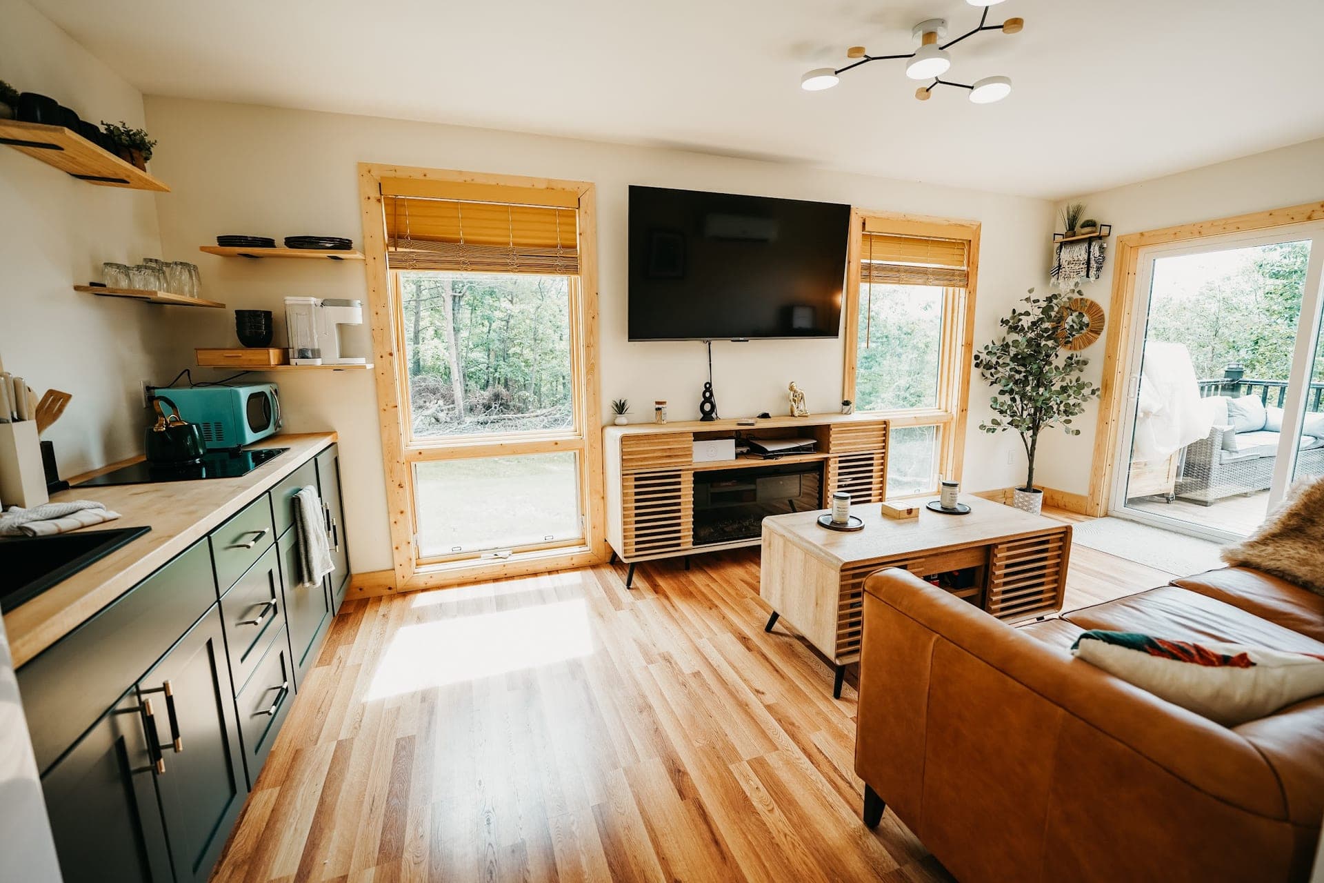 The open living room and kitchen, with windows on three sides
