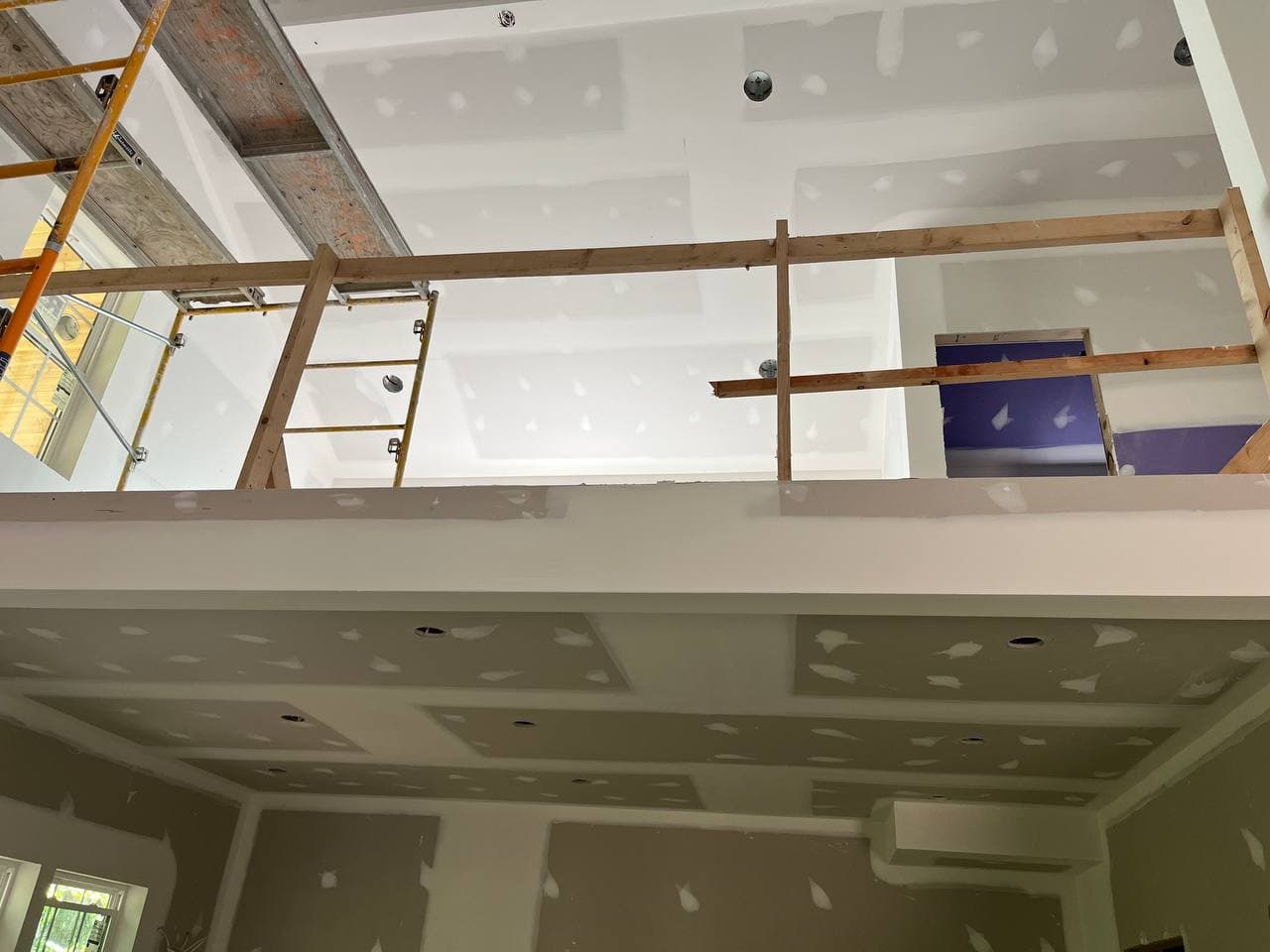 Mezzanine level — tray ceiling and recessed lighting